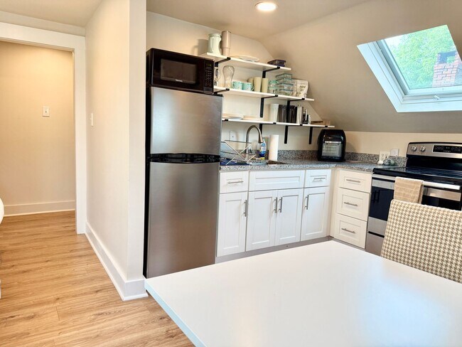 Building Photo - All Inclusive West End Condo-Fully Furnished with Parking!