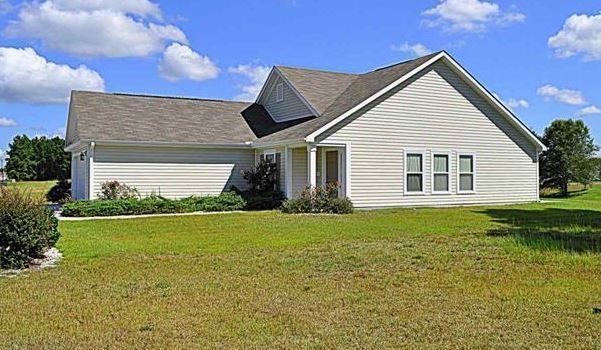 Building Photo - Like New 3 Bedroom & 2 Bath pond front home in Hillsborough! Enjoy the Community Pool, Playground...