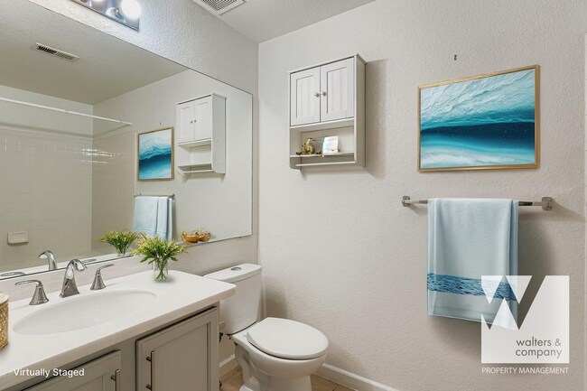 Building Photo - Light-Filled Corner Condo with Garage + Reserved Parking in Gated Community