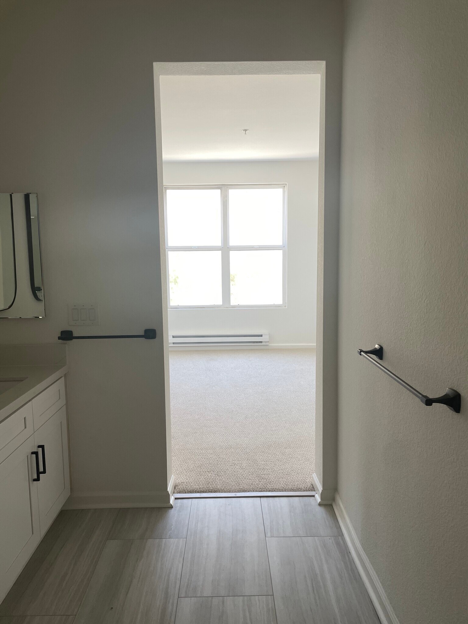 En-suite primary bath with dual sinks connected to primary bedroom - 1 Crescent Way