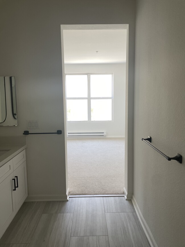 En-suite primary bath with dual sinks connected to primary bedroom - 1 Crescent Way