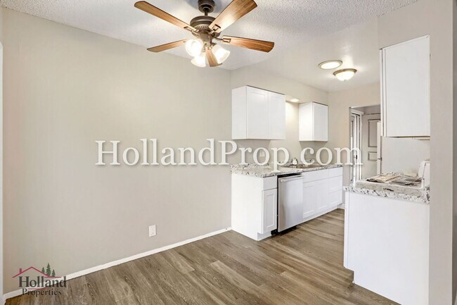 Building Photo - Charming 3-Bedroom Duplex with Fenced Yard, Fireplace & Garage Near Hwy 26!