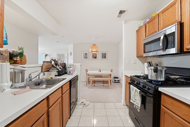 Building Photo - Bathed in natural light, this stunning second level condominium offers an effortless blend of com...