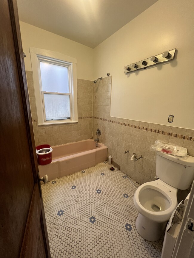 New Vanity, toilet, mirror, and lights being installed. - 4321 W Thomas St