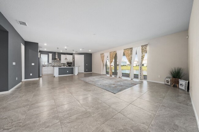 Building Photo - Immaculate Executive Home in Isles of Lake Nona