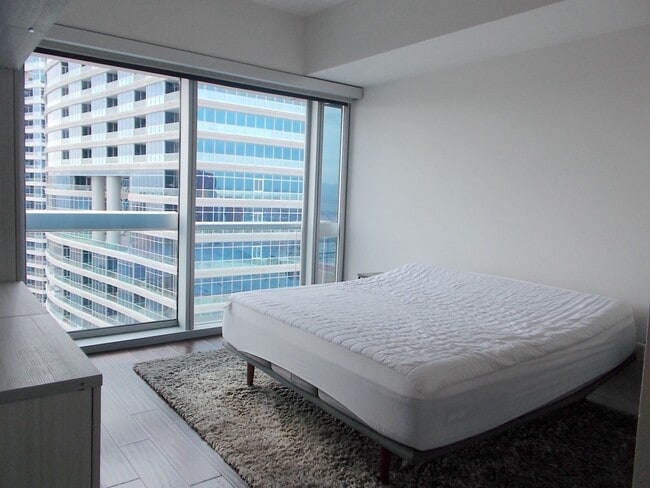 Building Photo - Experience elevated high-rise living at The Martin.