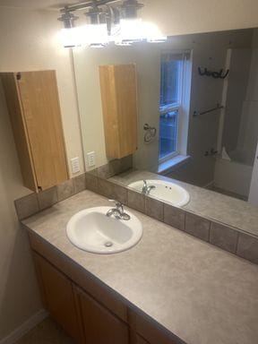 Building Photo - LIKE NEW three bedroom with fantastic updates, one car garage and private newly fenced front patio!