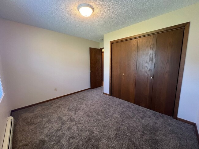 Building Photo - Fully Renovated 2-bed, 1-bath Apartment with a Garage Stall!