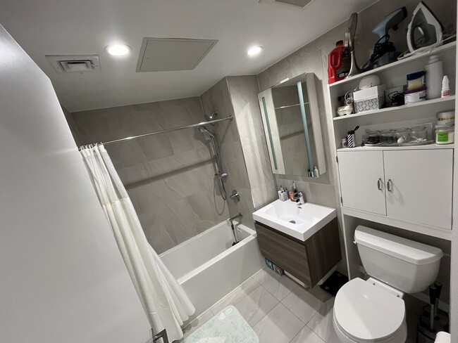 Bathroom includes shower rod and standing cabinet - 1433 31st Ave