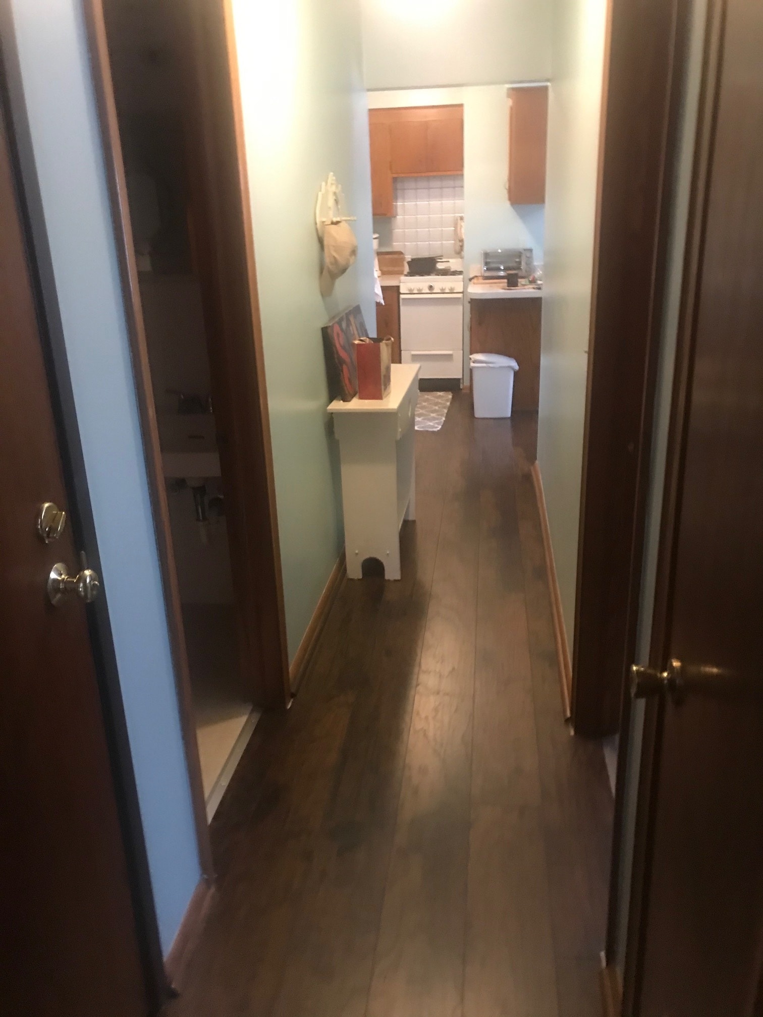 Hallway wit hardwood floors - 390 57th Pl NE