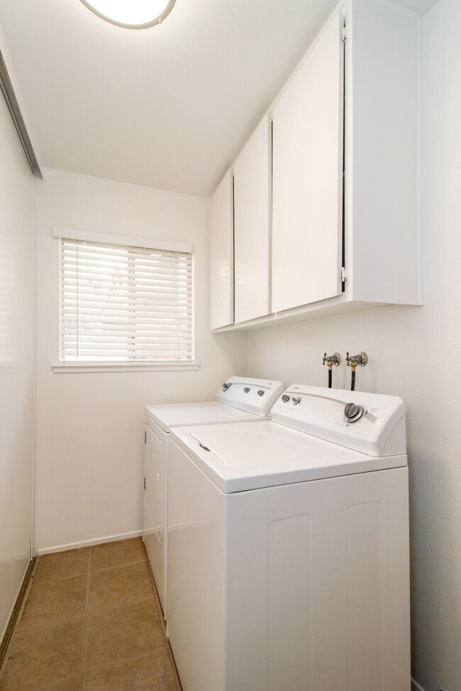 Laundry room with ample additional storage (washer/dryer included) - 4721 N Cedar Ave