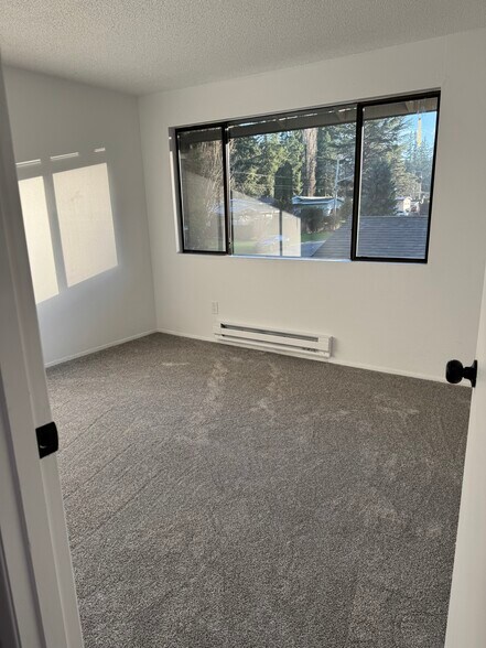 Plenty of light in upstairs bedrooms and new carpet. - 1717 150th Ave SE
