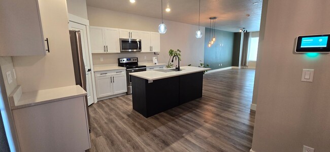 Building Photo - Come check out this beautiful 3 story town...