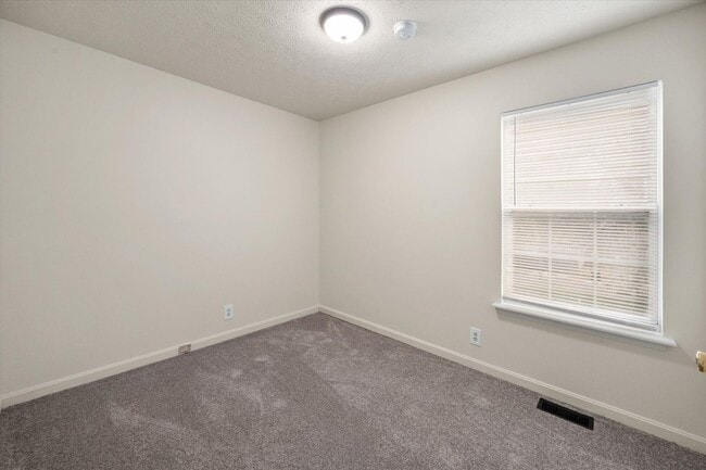 Building Photo - Three Bedroom House With Brand New Carpet