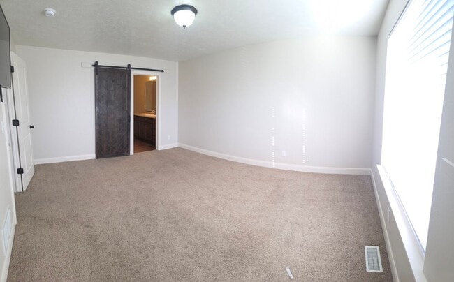 Building Photo - Spacious 4-Bedroom Home in Highly Sought-After Summerfield Community!