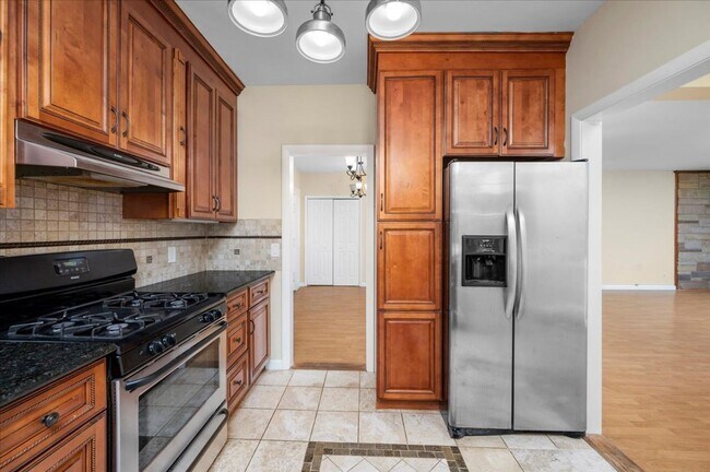 Building Photo - Elegant Multi-Level Brick Residence with Outdoor Oasis