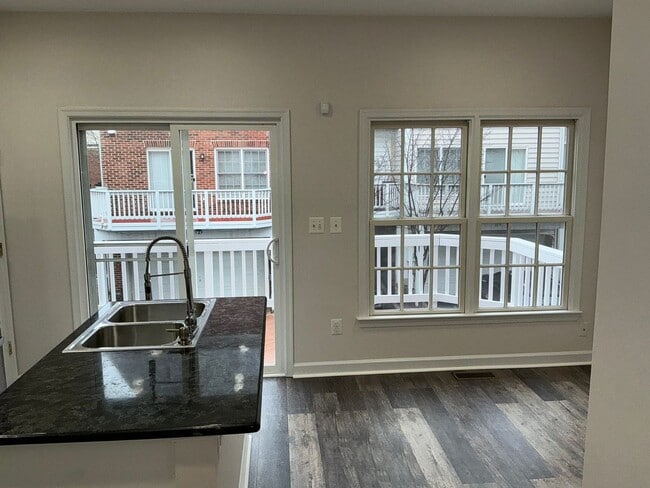 Building Photo - Beautiful 4BR 4.5BA 4 level townhome with 2 car attached garage located in the Fallsgrove Community