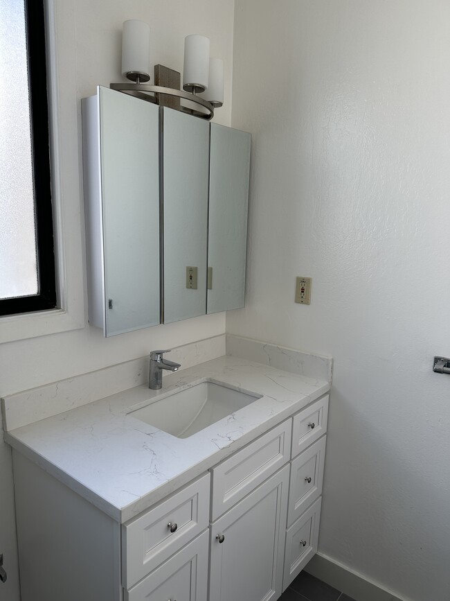 New Vanity and Vanity Sink , New Vanity Faucet, New Grey Tile Floor - 1271 10th Ave