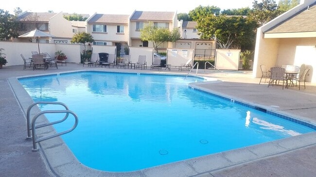 Building Photo - Stunning 4BR Townhome with Hardwood Floors, Private Patio, Community Pool & 2-Car Garage!