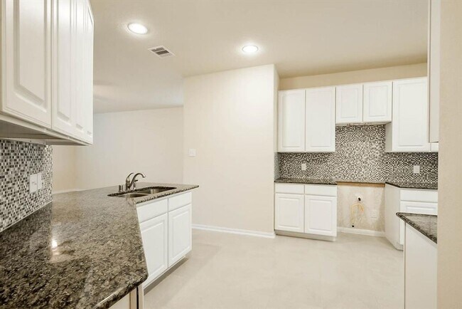 Building Photo - Beautiful stone front 4 bedroom, 3 bath home has bay windows in breakfast nook & master. It is on...