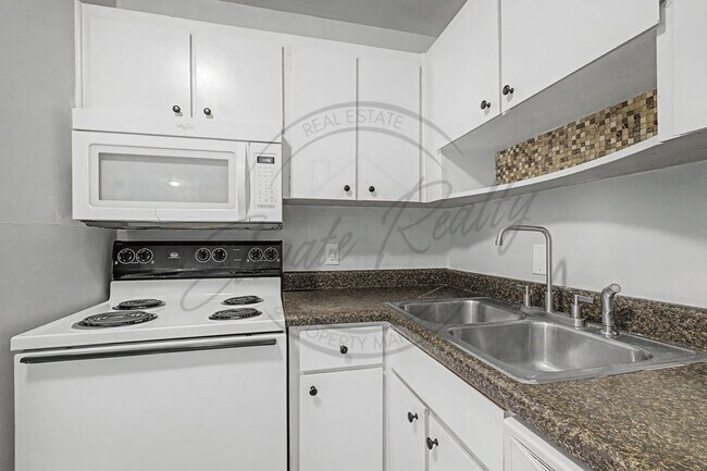 Building Photo - SPRING SPECIAL!! FIRST MONTH FREE on this Two Bedroom Condo, Second Floor, across from Madison Pa...