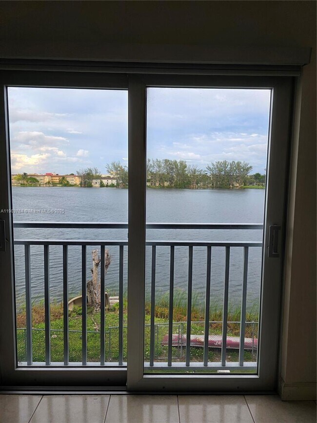 Building Photo - 9917 W Okeechobee Rd