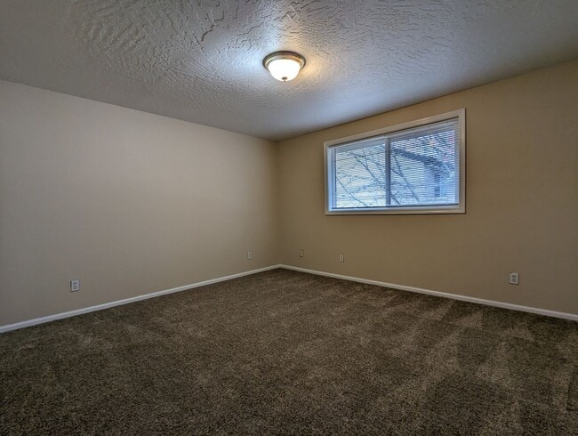 Building Photo - Beautiful 2-Bedroom, 1.5-Bath Condo. Landscaping included!