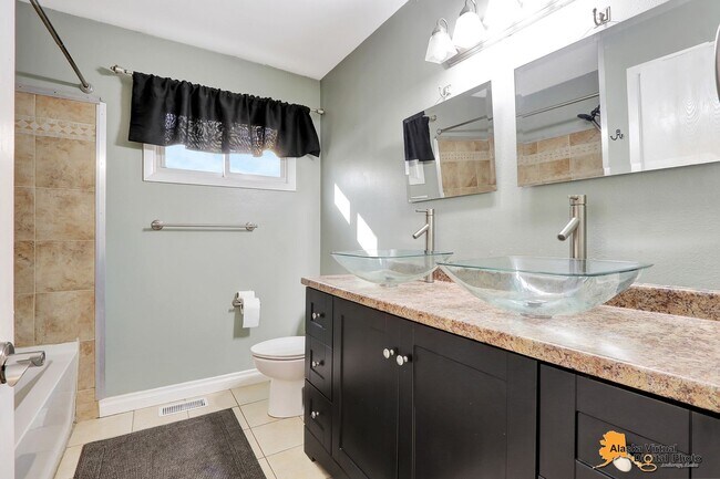 Building Photo - Eagle River Home w/ Fenced Yard, Sunroom, and Garage!