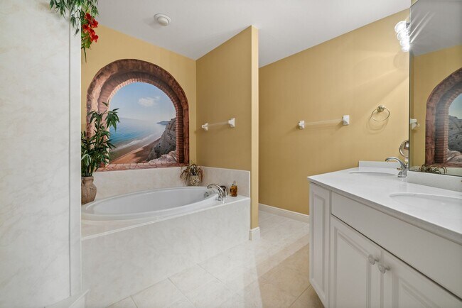 Building Photo - Experience Bell Tower Park. GATED ground floor 2 Bed 2 Bath Den 1 Car Garage Condo.