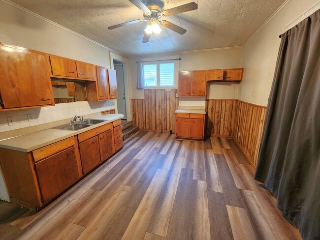 Building Photo - Nice home with oversized 2car gar with work bench and large shaded yard. Country-like setting