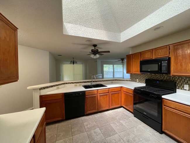 Building Photo - SPACIOUS HOME - NEW FLOORING! - 2 LIVING A...