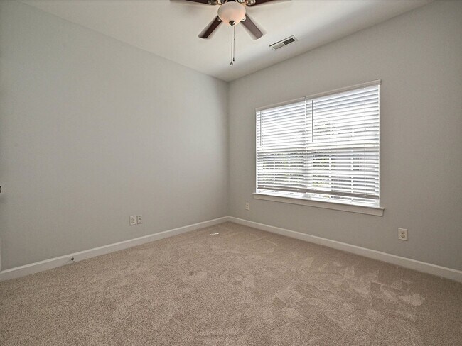 Building Photo - Stylish Condo Living with Open Concept, Garage & Outdoor Space