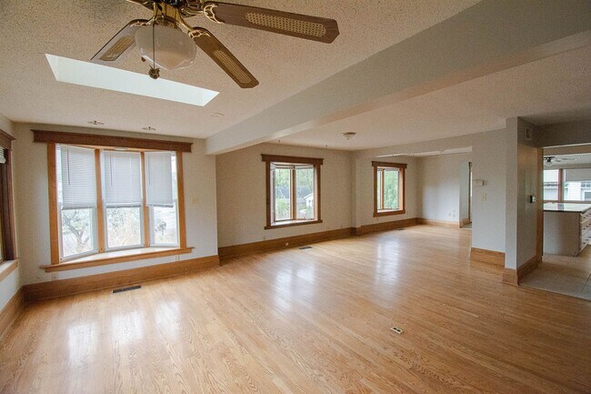Building Photo - Bright, beautiful home with 3 garage spaces & tons of storage!