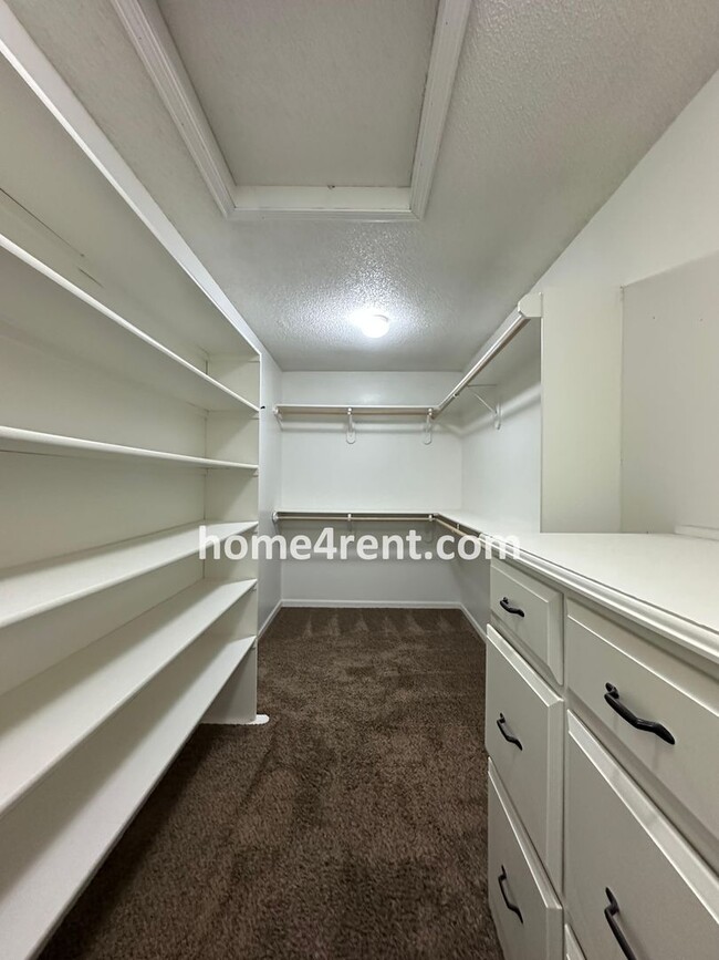 Building Photo - Updated Kitchen, Large Two Tiered Deck, Finished Basement in Blue Valley Schools!