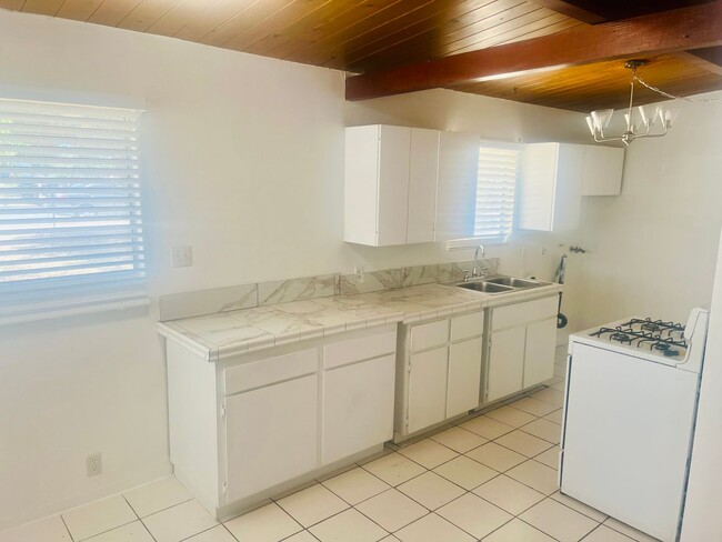 Building Photo - Charming 3-Bedroom Home with Wood Ceilings...