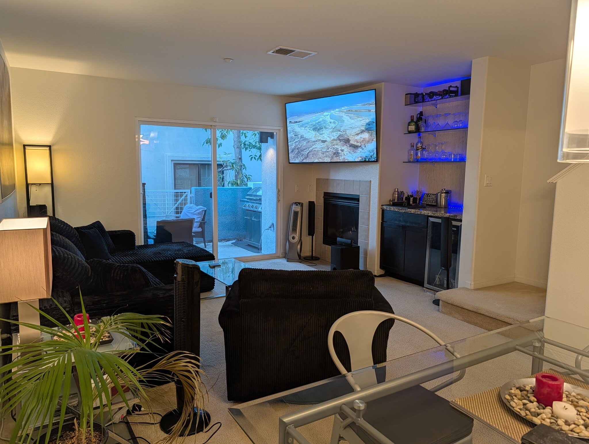 View of fully furnished living room, bar and balcony. - 3542 Shoreline Bluff Lane
