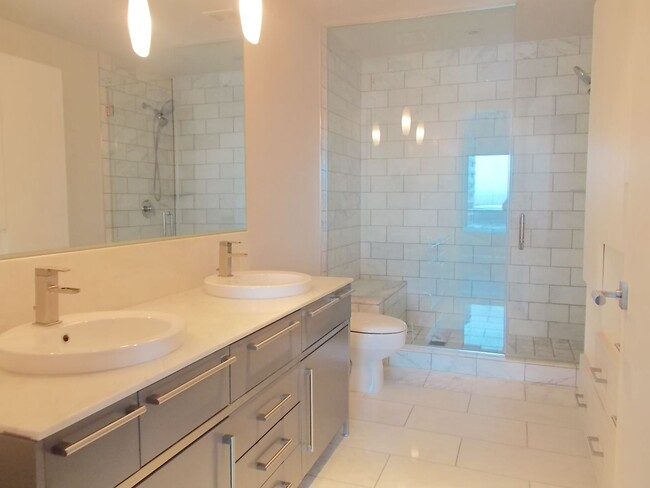 Building Photo - Experience elevated high-rise living at The Martin.