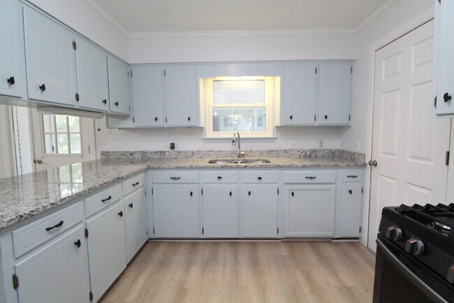 Building Photo - Spacious 4BR, 2BA Central Pensacola Home on a Large Corner Lot with Sunroom & 2-Car Garage