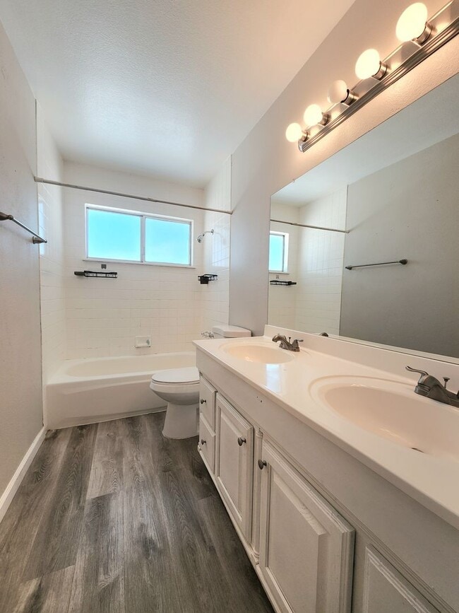 Building Photo - 4 Bedroom Two-Story Home with Downstairs Primary Bedroom & Fireplace