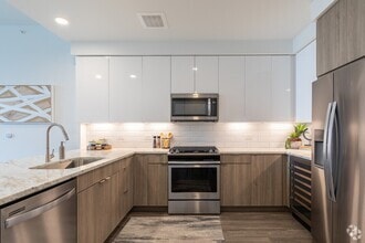 Building Photo - 8 Weeks Rent-Free in Uptown Luxury!