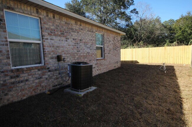 Building Photo - West Pensacola Duplex Living — 3BR Home with Open Floor Plan, Eat-In Kitchen, Covered Patio & Low...