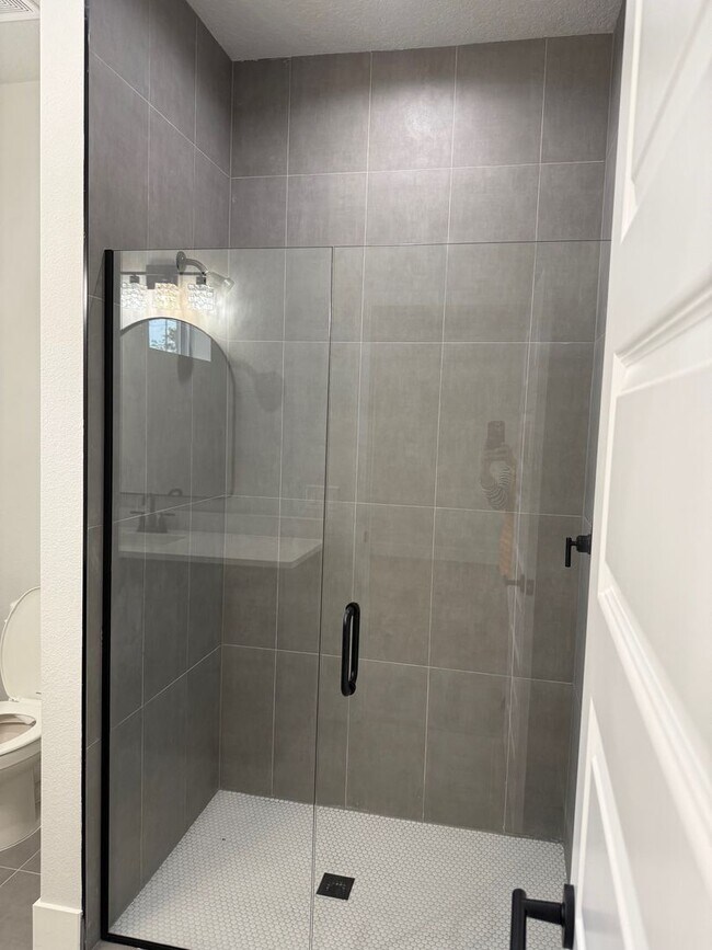 Building Photo - Brand new 3/2/2 with fenced in yard and a screened in porch!