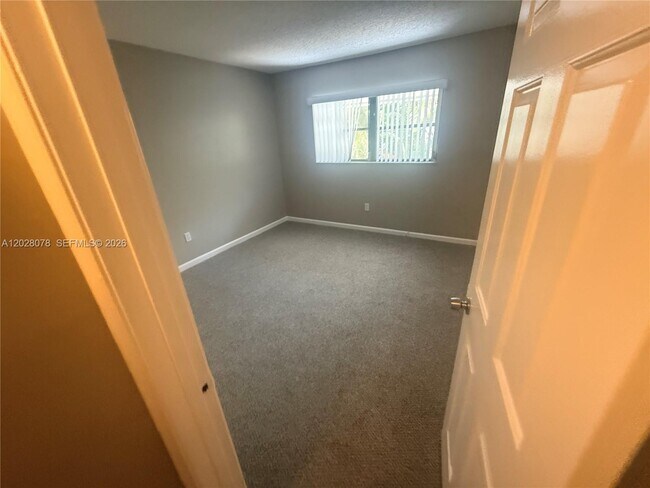 Building Photo - 10787 Royal Palm Blvd
