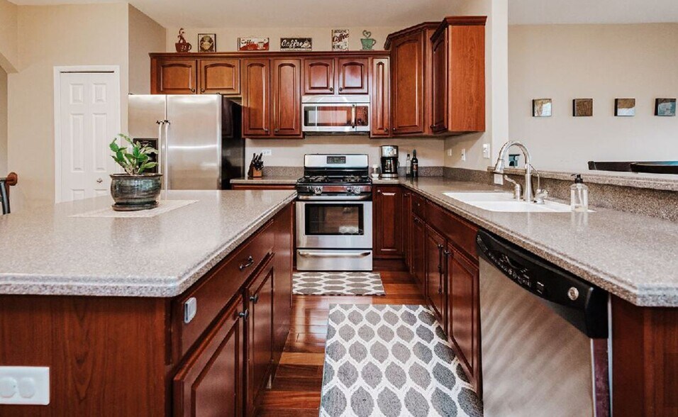 Kitchen cabinetry and gas stove - 1161 Kilbery Ln