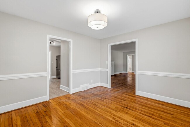 Building Photo - NW - Large Brick Ranch, Updated, Hardwoods, LR, DR, Den, Two Decorative Fire Places, Fenced, Stor...