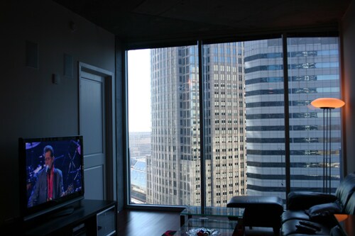 Living room with Bank of America HQ view - 210 N Church St