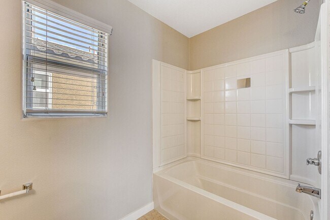 Building Photo - Spacious 3 bedroom home with large yard in...