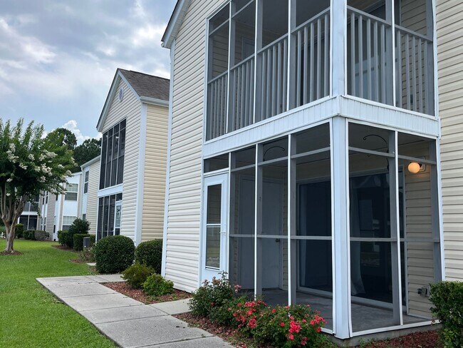 Building Photo - First Floor, Unfurnished, 3 Bedroom, 2 Bath Condo with Screened-in Back Patio!