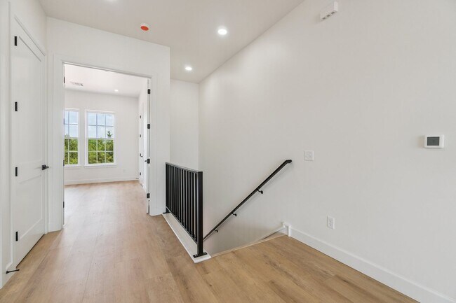 Building Photo - Bright. Clean. Calm. Your Elevated One-Bed...