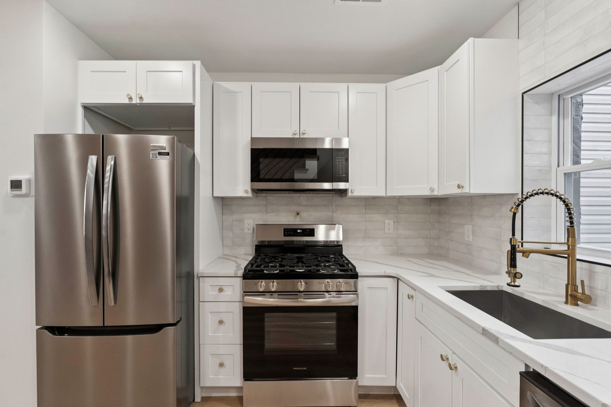 Kitchen with stone countertop and stainless steel appliances - 1544 S Bambrey St